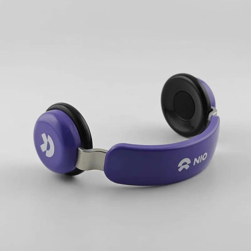 The ear cups and headband of the headphones are purple.